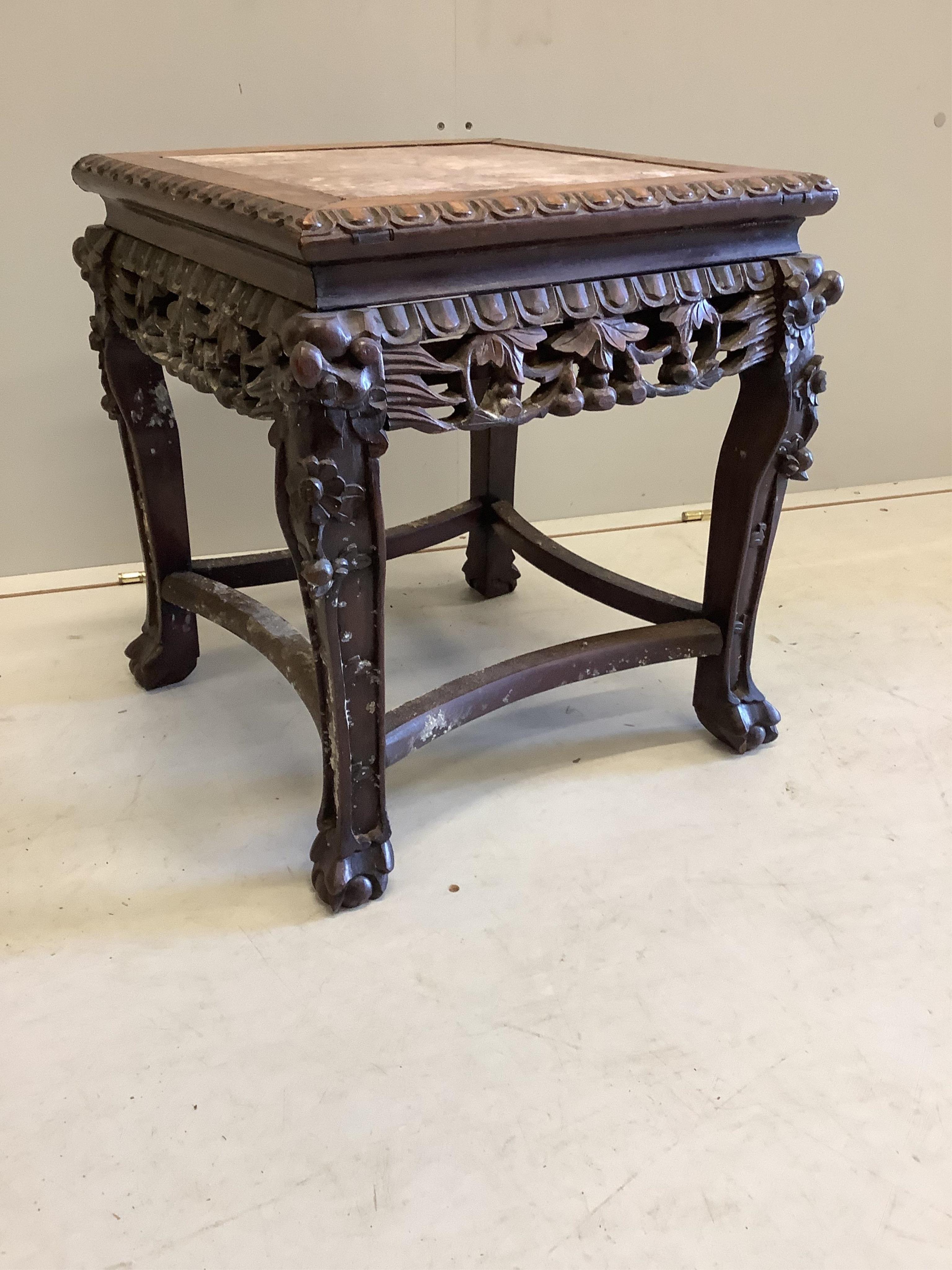 A late 19th century Chinese rouge marble topped hardwood vase stand, width 42cm, depth 42cm, height 46cm